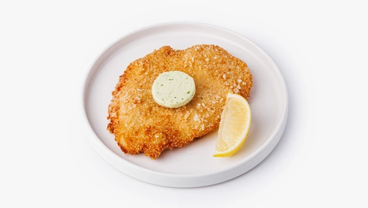 Шницель куриный с пряным маслом и лимоном