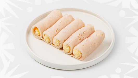 Рулетики из куриной ветчины с сыром