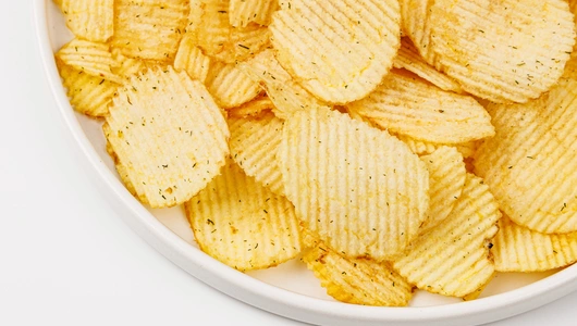 Чипсы картофельные рифленые со вкусом "Молодой чеснок с укропом" Чипсы картофельные рифленые со вкусом "Молодой чеснок с укропом"