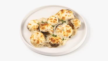 Изображение товара Шампиньоны фаршированные сыром и соусом бешамель