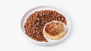 Изображение товара Куринная котлета под сырно-грибной шапкой с гречкой 238 рублей