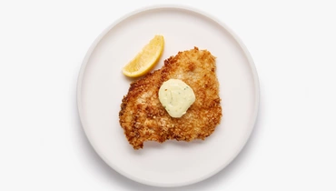 Изображение товара Шницель куриный с пряным маслом и лимоном