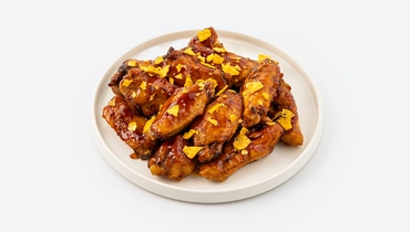 Изображение товара Крылья куриные "Барбекю" с посыпкой из начос с копчёной паприкой