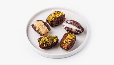 Изображение товара Ассорти фиников с начинкой из ореховых паст и орехов 5 шт