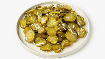 Изображение товара Огурцы соленые нарезанные с хреном - хрустящая закуска 150 г