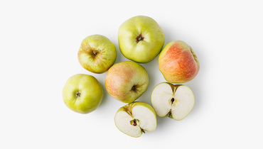 Изображение товара Яблоки сорта Богатырь жёлто-зелёные с румянцем, крупные и сочные