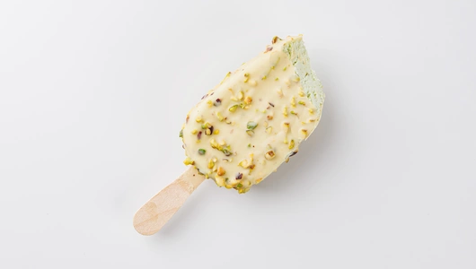 Эскимо фисташковое в белом шоколаде с фисташкой Эскимо фисташковое в белом шоколаде с фисташкой