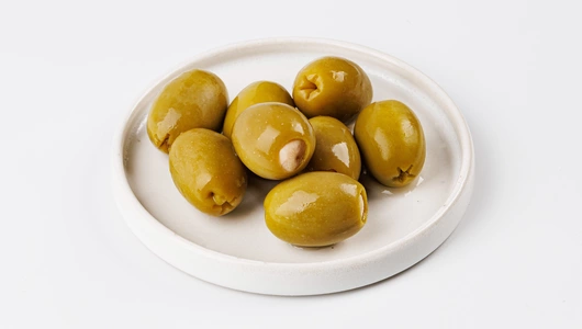 Оливки зеленые фаршированные чесноком, 120 г