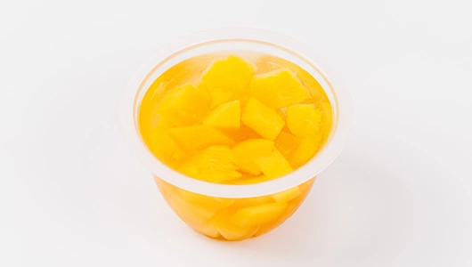 Персик кусочки в сиропе в стакане Персик кусочки в сиропе в стакане