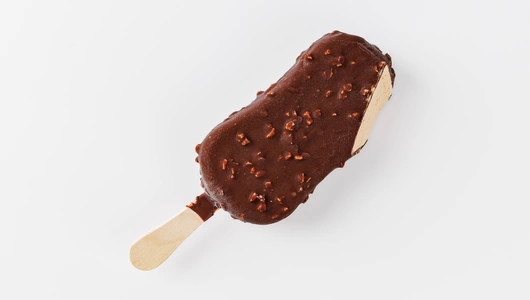 Эскимо пломбир кофейный с миндалем в темном шоколаде Эскимо пломбир кофейный с миндалем в темном шоколаде
