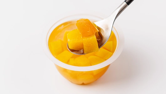 Персик кусочки в сиропе в стакане Персик кусочки в сиропе в стакане